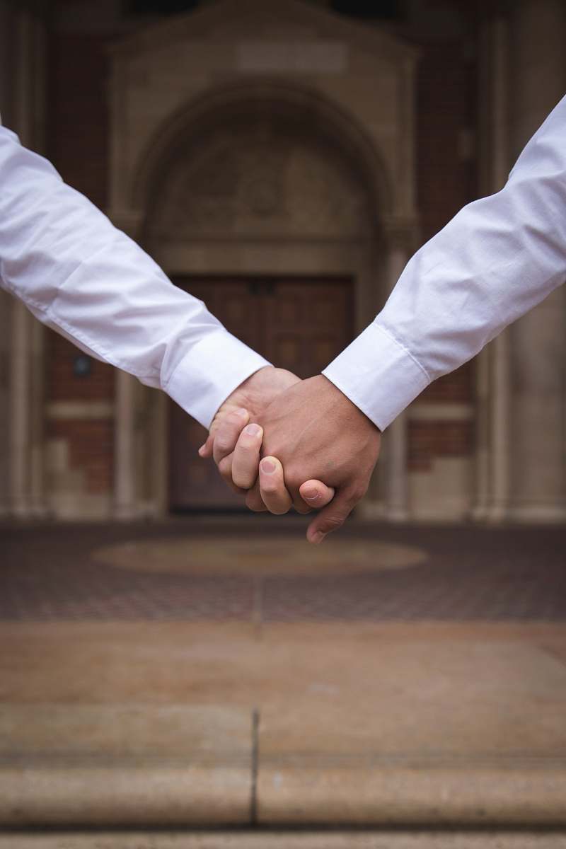 holding hands close-up photography of people holding hands during daytime university of california